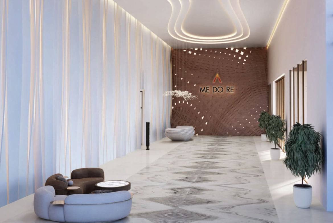 Modern building lobby with sculptural furniture and ambient lighting