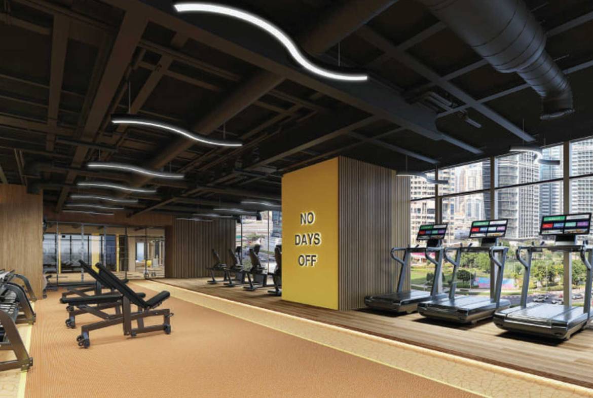 Modern Dubai gym with treadmills and “No Days Off” motivational wall