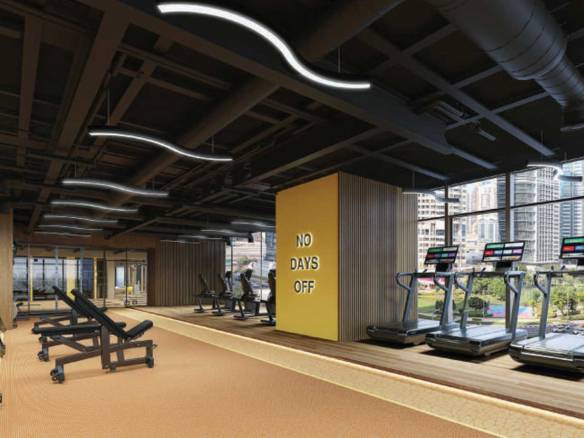 Modern Dubai gym with treadmills and “No Days Off” motivational wall
