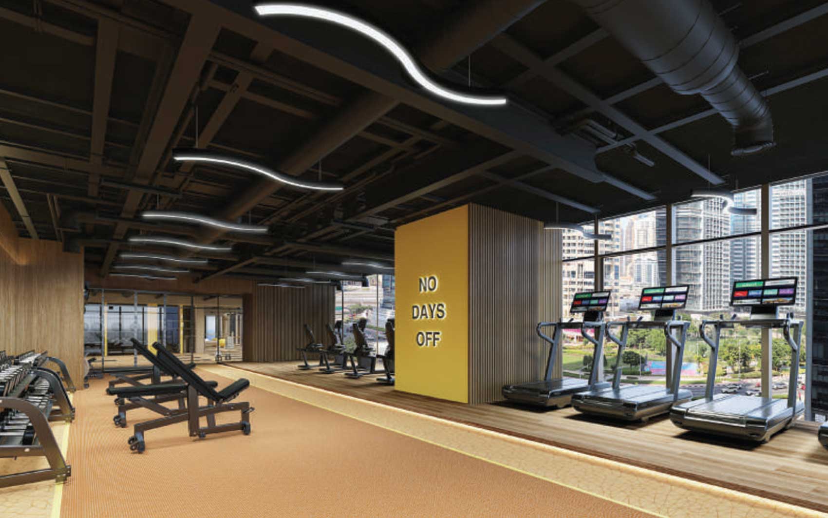 Modern Dubai gym with treadmills and “No Days Off” motivational wall