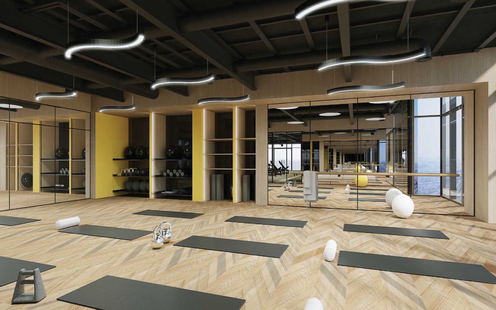 Yoga and pilates studio with mirrors, mats and city view windows
