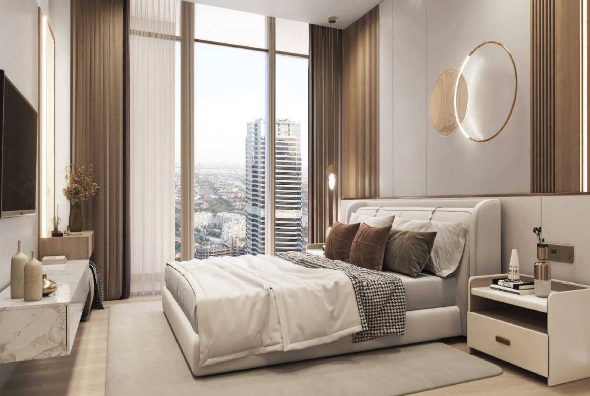 Elegant bedroom with soft lighting and panoramic city skyline view