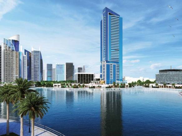 Modern Dubai skyscrapers reflecting in calm waterfront