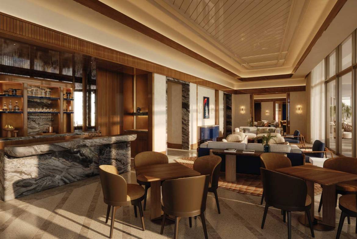 Elegant hotel lounge with marble bar counter, warm lighting, and contemporary seating area