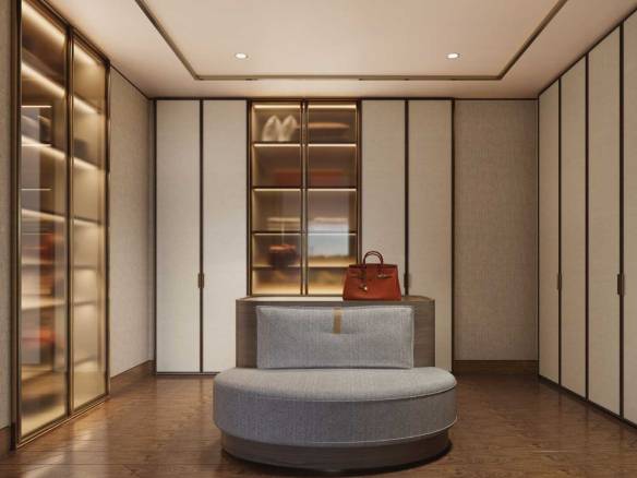Elegant walk-in wardrobe with glass cabinets and round seating