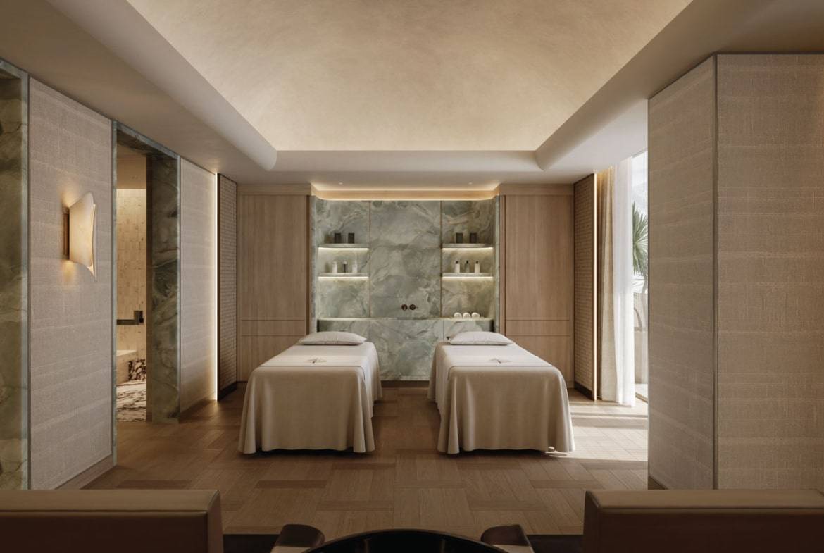 Luxury spa treatment room with twin massage tables and modern interior design