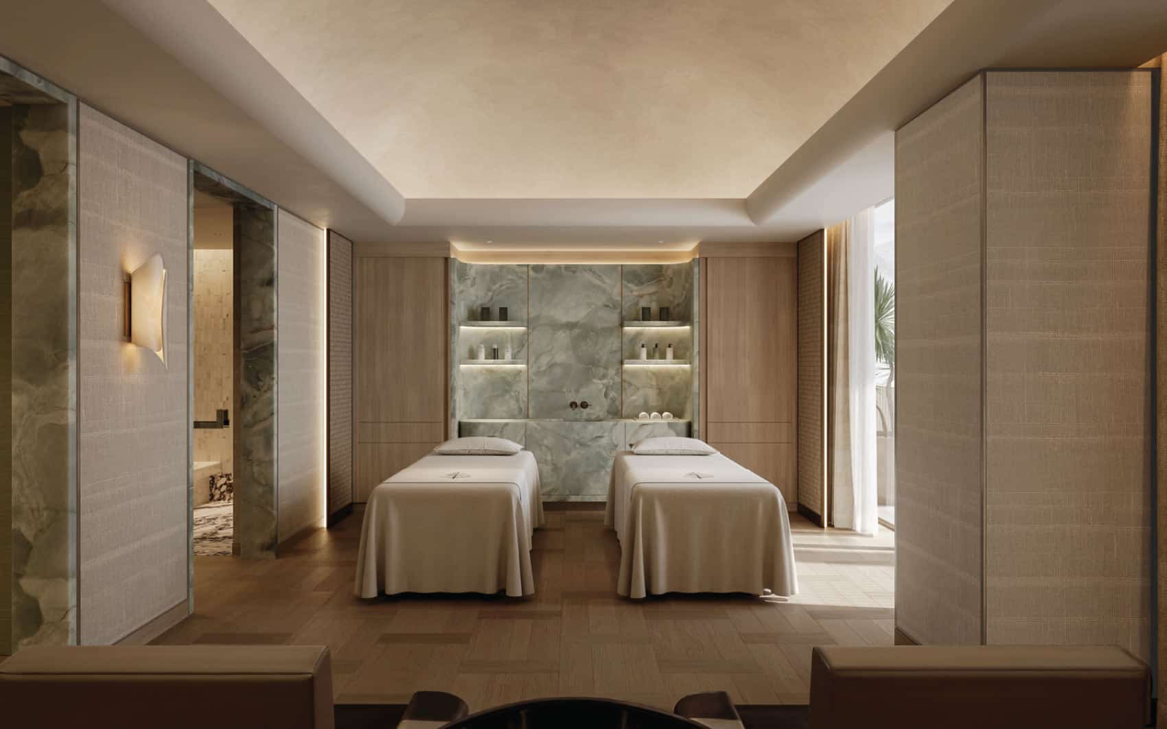 Luxury spa treatment room with twin massage tables and modern interior design