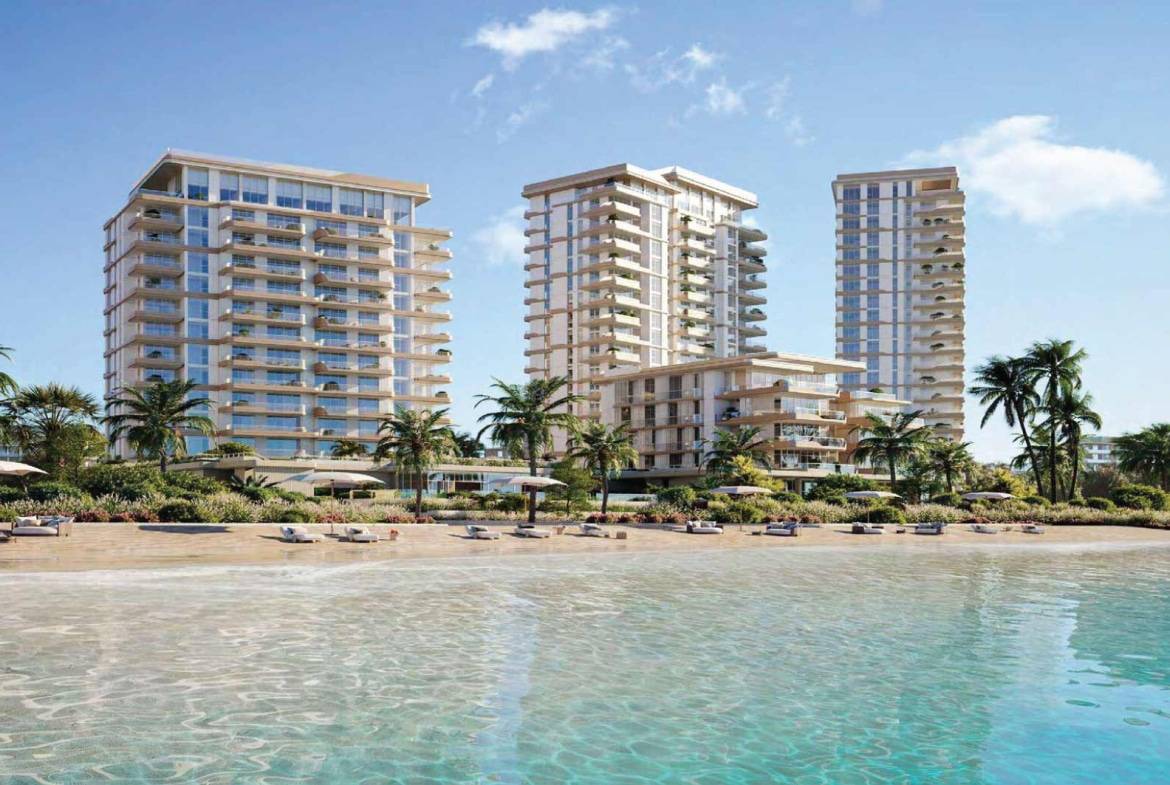 Beachfront residential towers with clear turquoise water