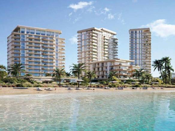 Beachfront residential towers with clear turquoise water