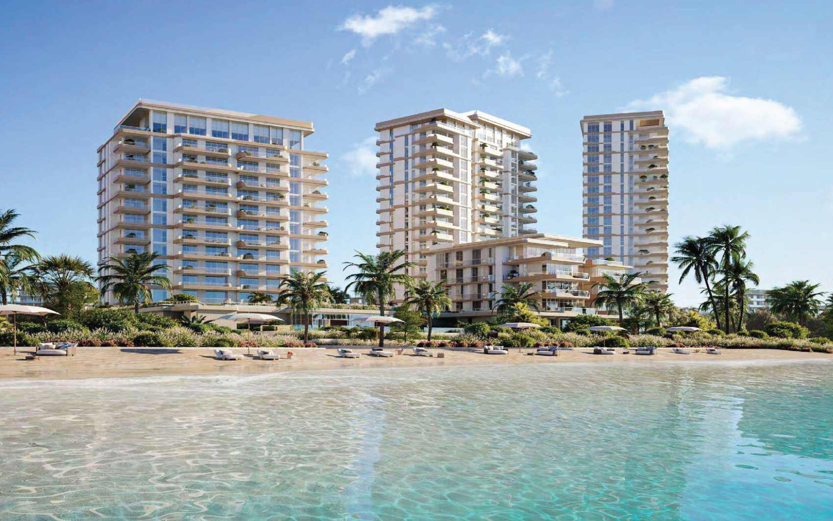 Beachfront residential towers with clear turquoise water