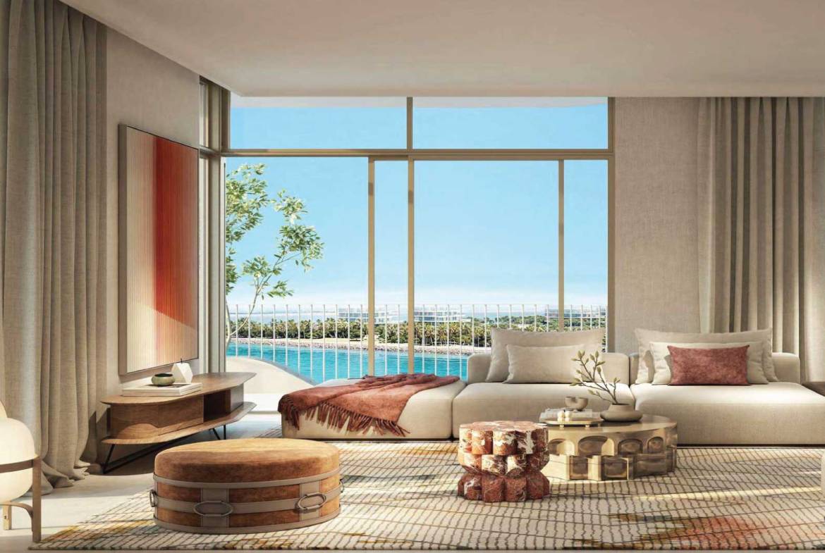 Luxury living room with floor-to-ceiling windows, neutral decor, and waterfront balcony view