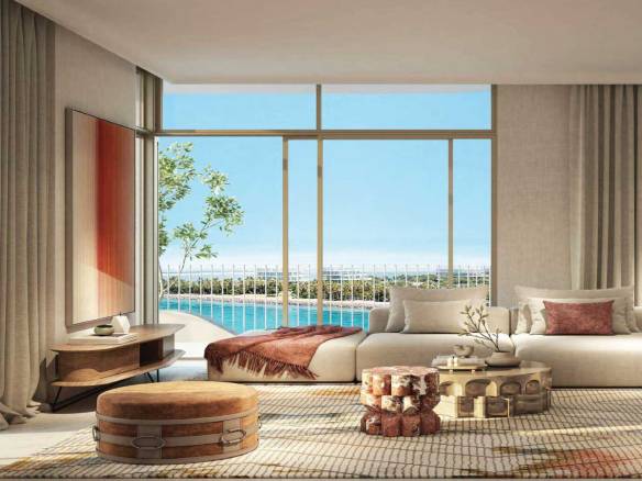 Luxury living room with floor-to-ceiling windows, neutral decor, and waterfront balcony view