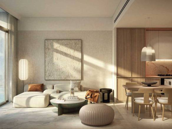 Bright open-plan living and dining area with neutral decor and marble-accented kitchen