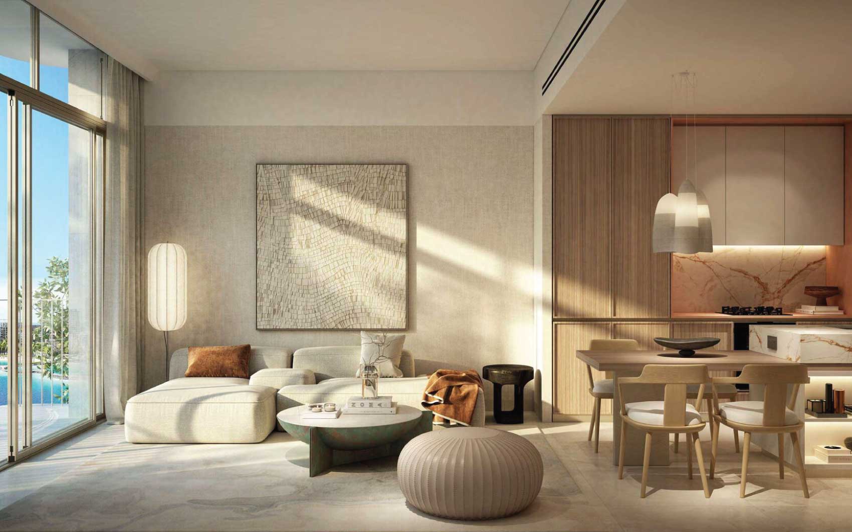 Bright open-plan living and dining area with neutral decor and marble-accented kitchen