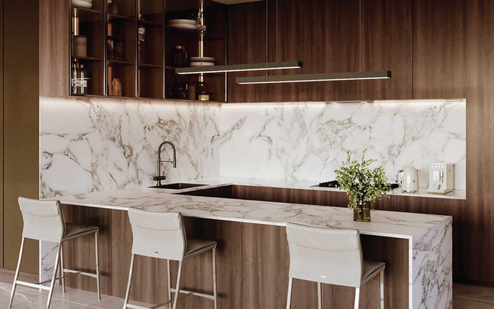 Contemporary kitchen design with white marble countertops, wood cabinetry, and breakfast bar