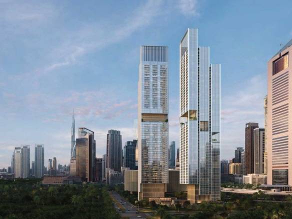Modern twin skyscrapers in Dubai skyline with surrounding high-rise buildings