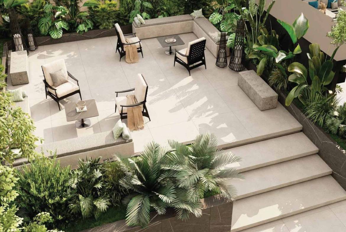 Private outdoor terrace with comfortable seating and lush tropical greenery
