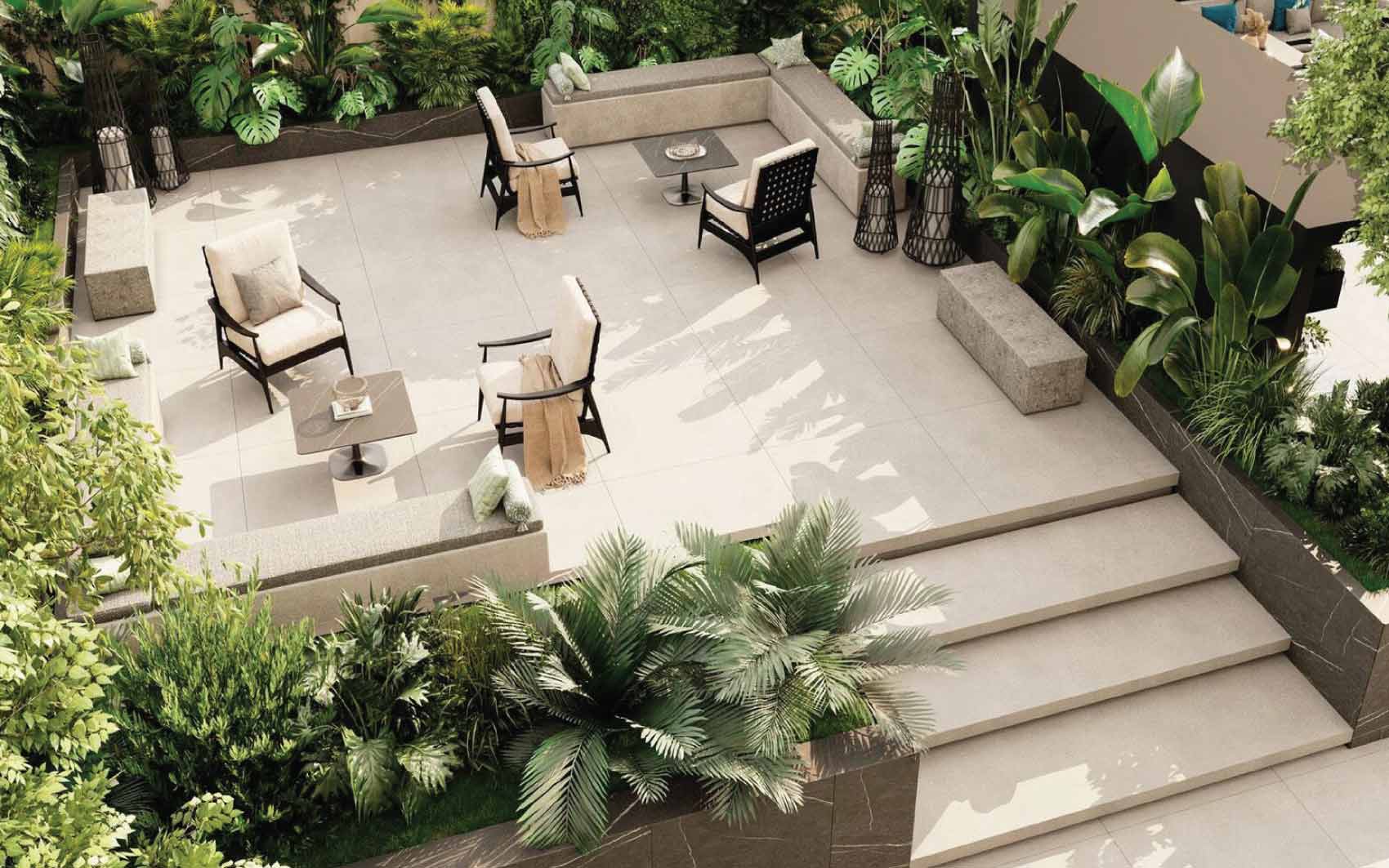 Private outdoor terrace with comfortable seating and lush tropical greenery