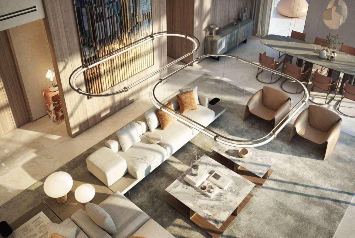 Elegant open-plan living and dining area with designer lighting and marble tables