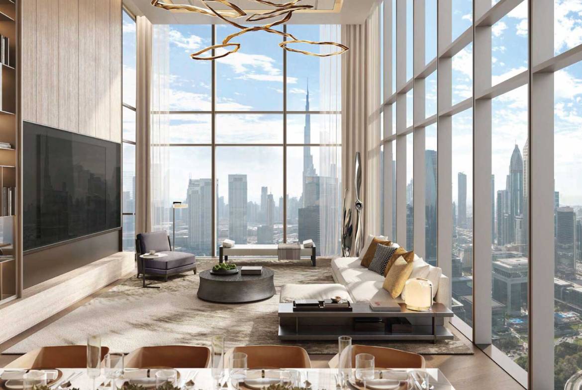 Elegant living room with double-height windows overlooking Dubai skyline