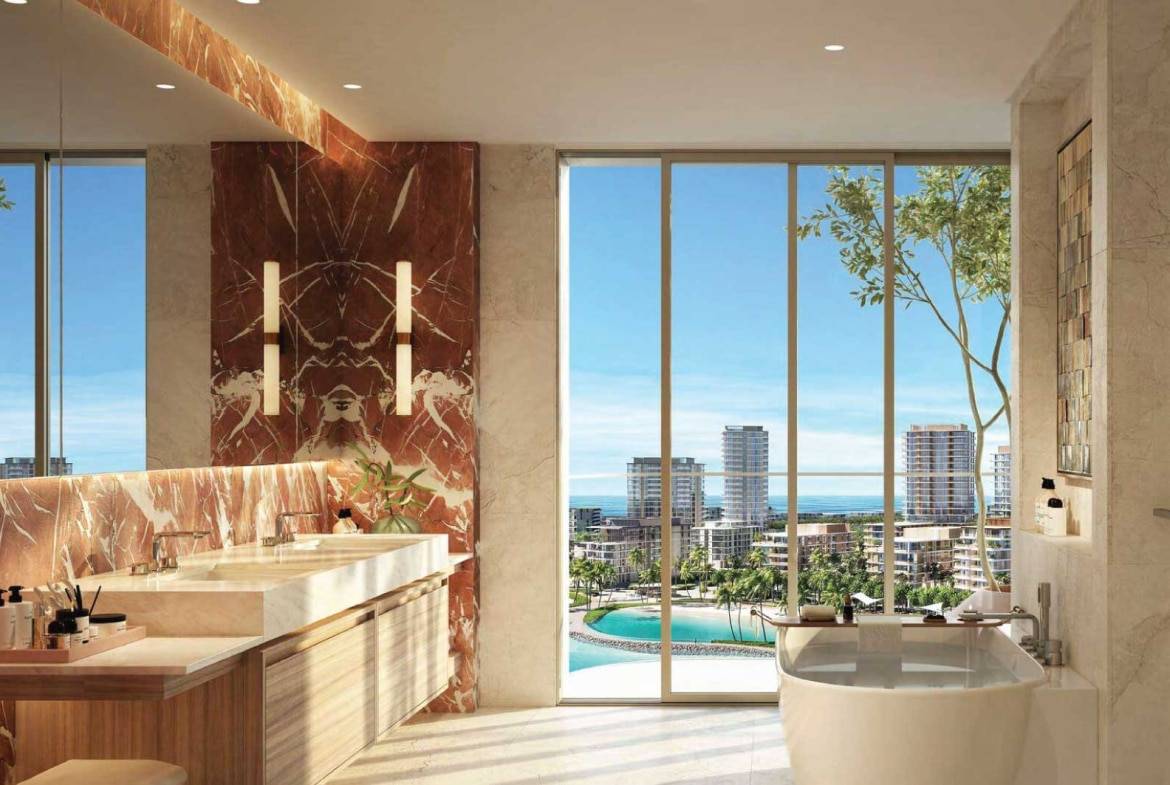Elegant bathroom with marble accents, dual sinks, and ocean view from large windows