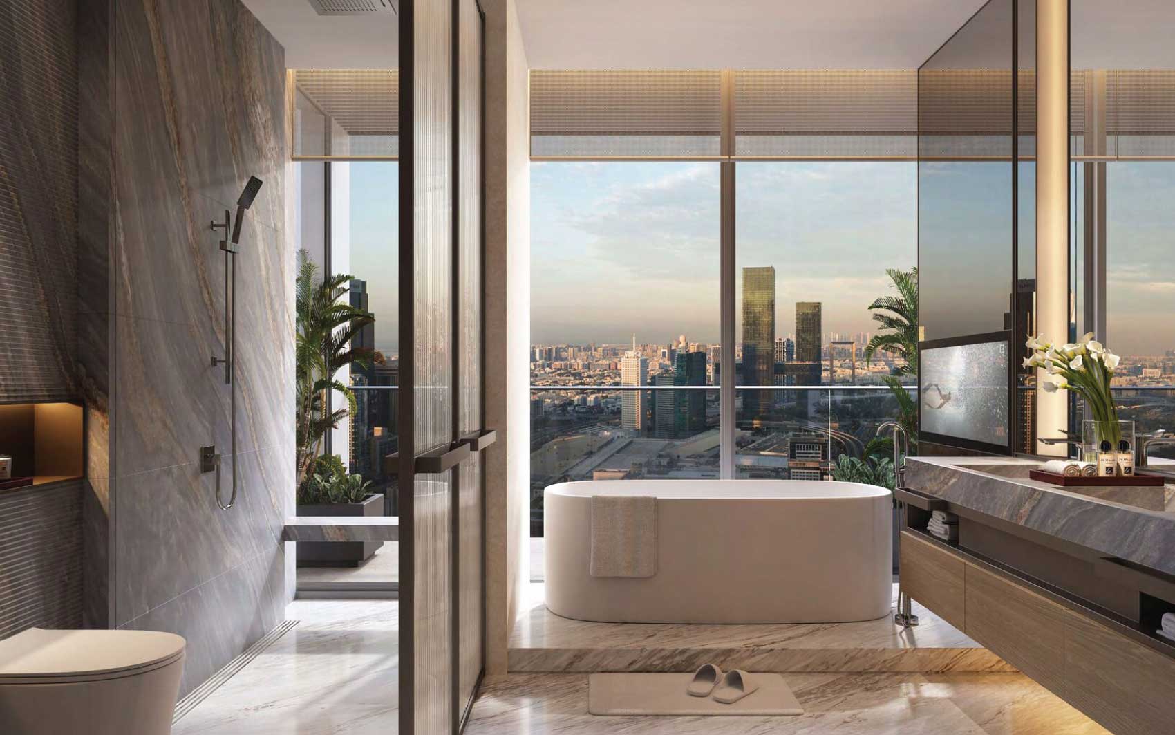Luxury bathroom with freestanding tub, marble finishes, and panoramic city skyline view