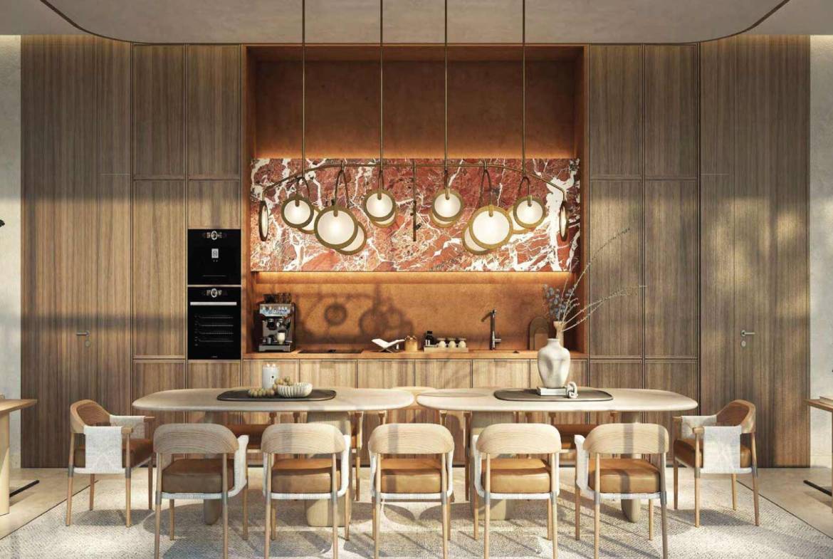 Luxury dining area with modern pendant lights and marble backsplash