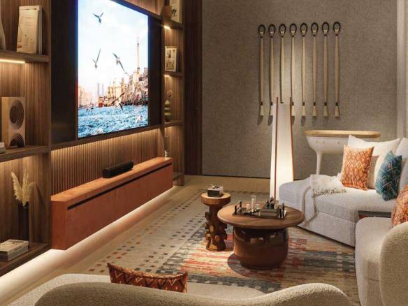 Cozy home theater room with large screen, designer lighting, and comfortable seating