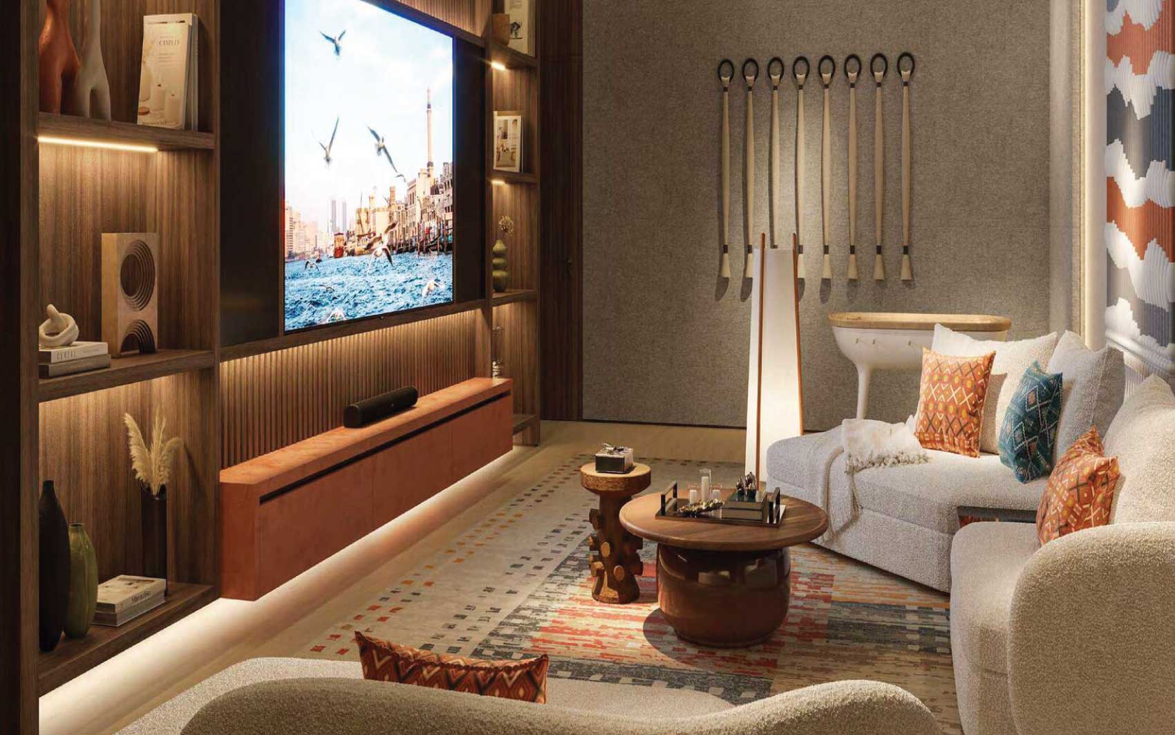 Cozy home theater room with large screen, designer lighting, and comfortable seating