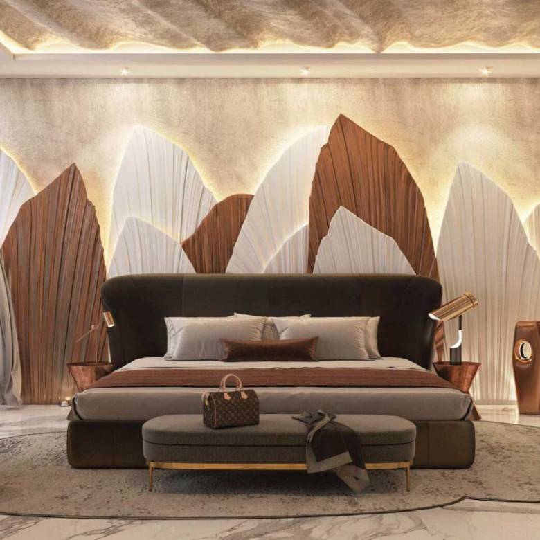 Luxurious bedroom with sculptural wall design, plush seating, and marble floors in warm tones
