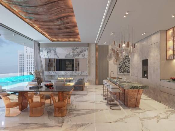 Luxury open-plan kitchen and dining area with marble finishes, designer lighting, and infinity pool view