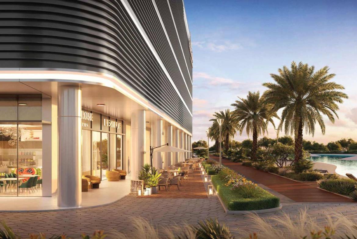 Upscale retail and dining promenade with outdoor seating and palm-lined walkway