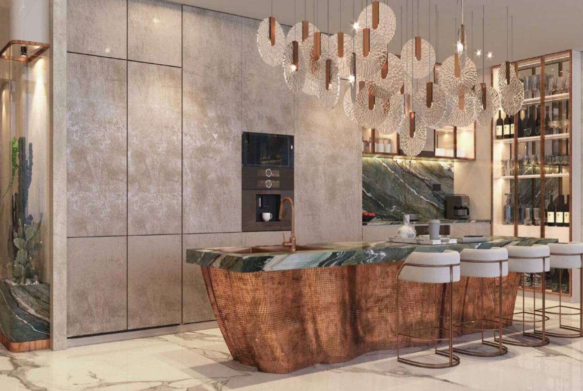 Modern kitchen with artistic copper island, marble countertops, and designer lighting
