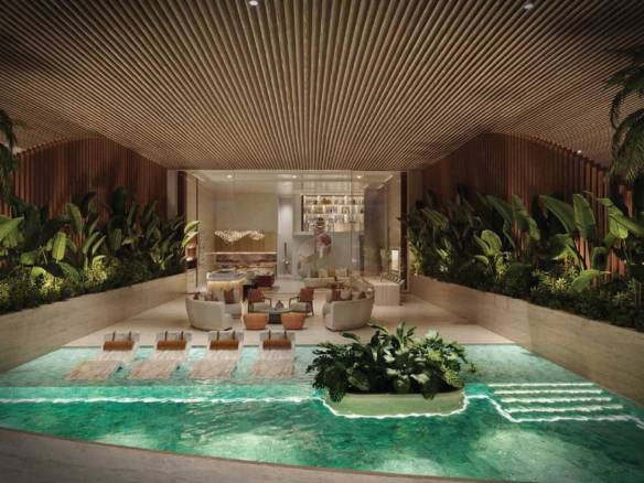 Indoor luxury pool with tropical plants and modern lounge area