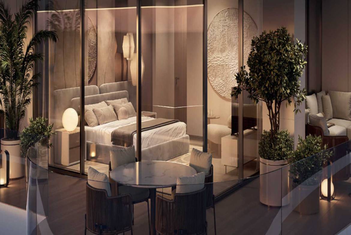 Luxury bedroom with floor-to-ceiling glass, private balcony, and stylish seating area