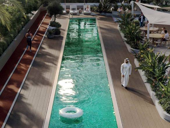 Outdoor lap pool with running track, tropical landscaping, and leisure seating areas