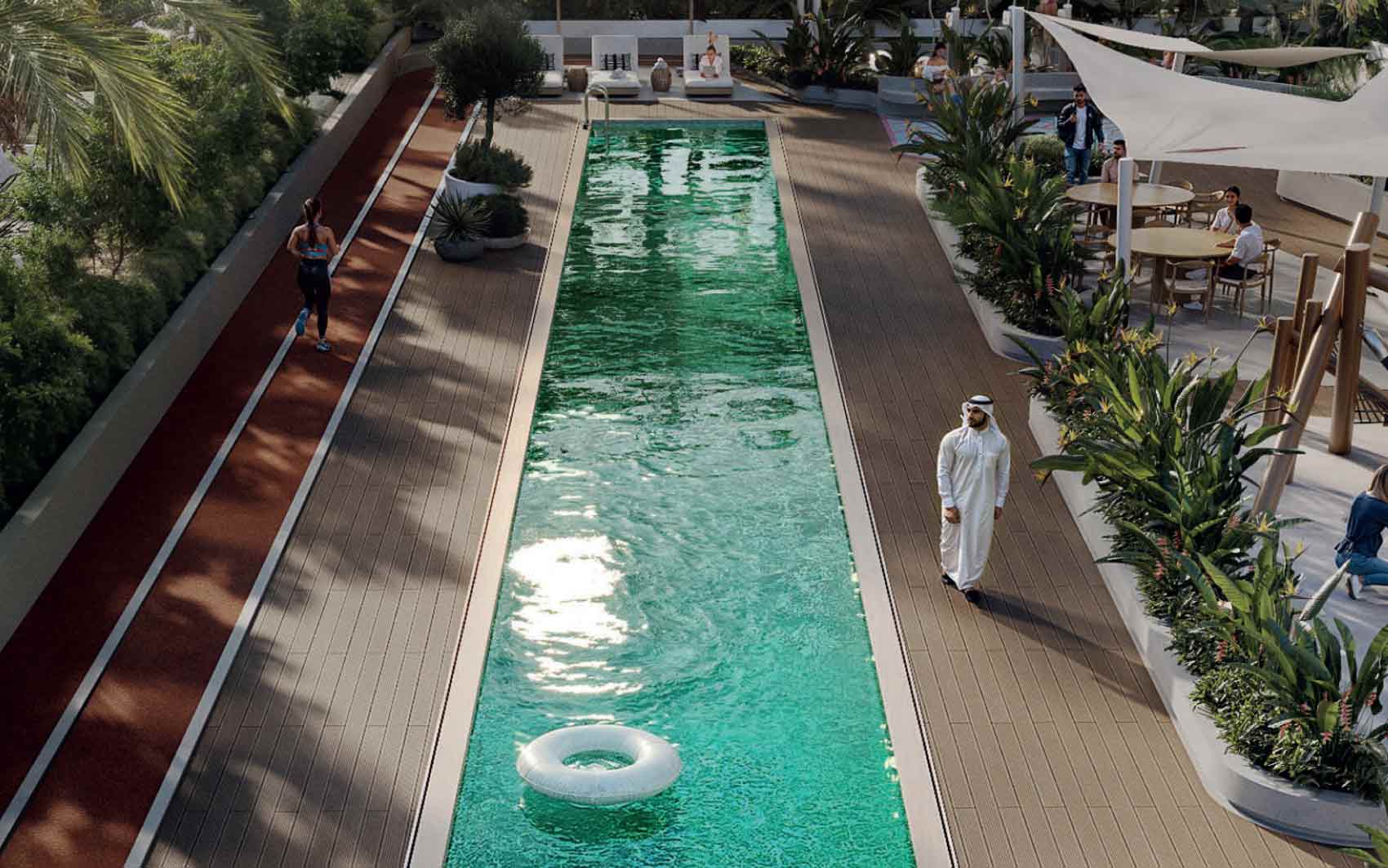 Outdoor lap pool with running track, tropical landscaping, and leisure seating areas