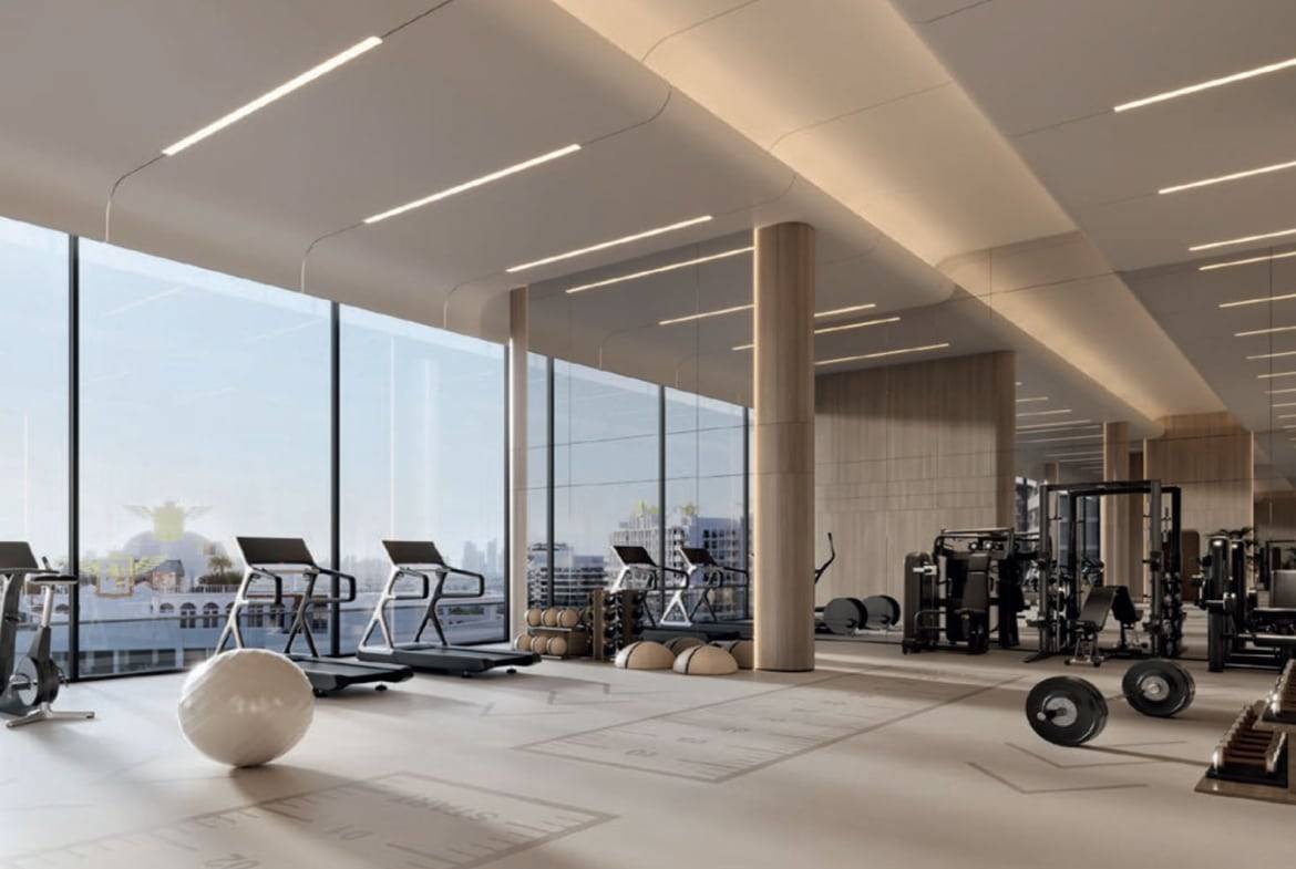 Spacious luxury gym with panoramic windows and state-of-the-art fitness equipment