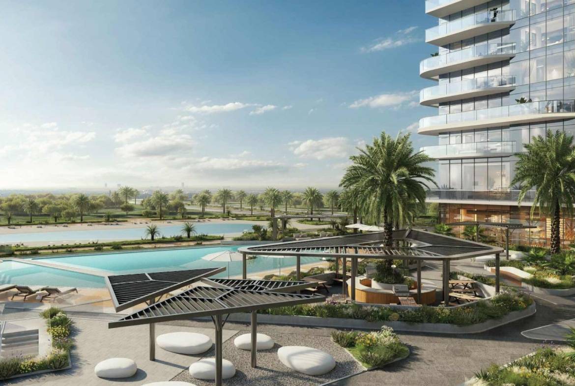 Resort-style outdoor pool area with palm trees and modern seating spaces