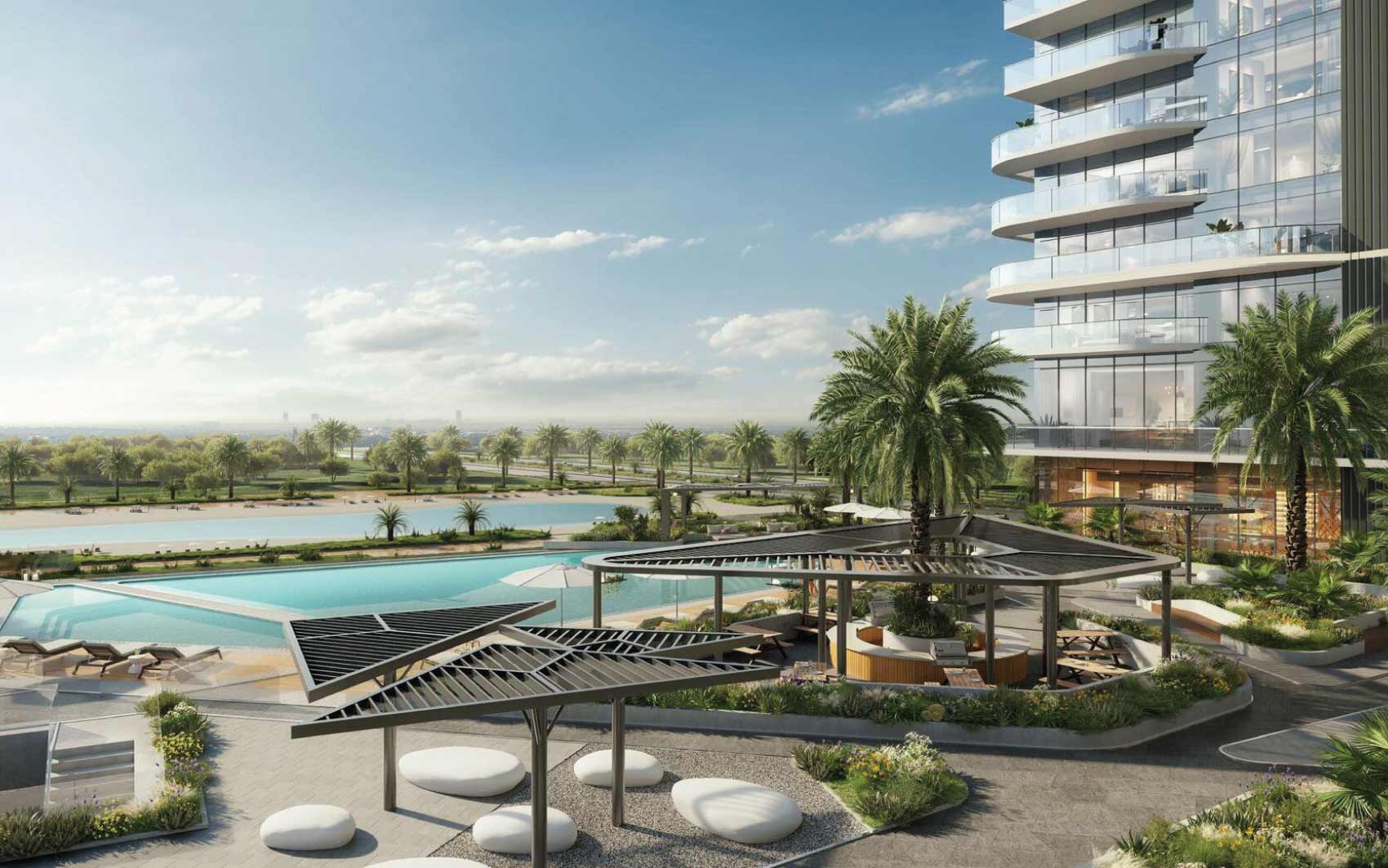 Resort-style outdoor pool area with palm trees and modern seating spaces
