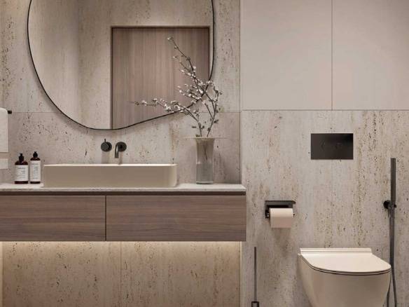 Modern bathroom with floating vanity, round mirror, and stone walls