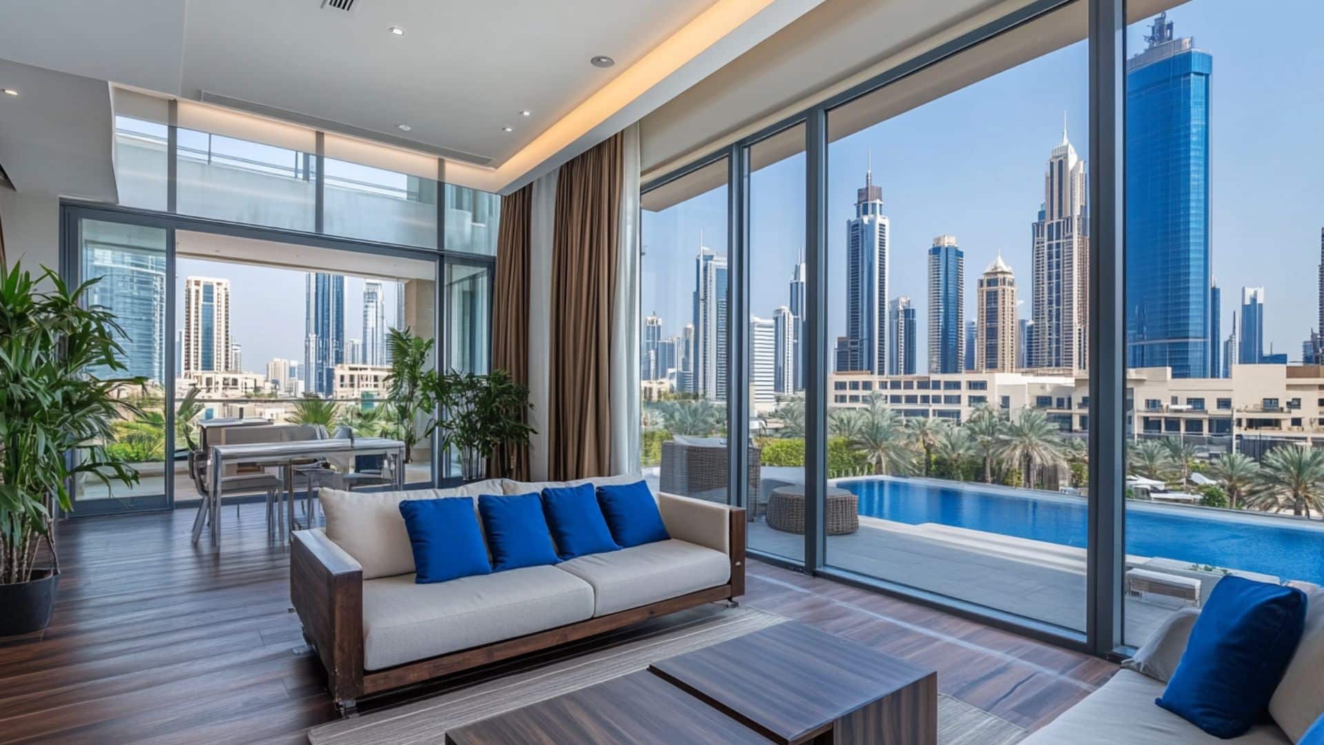Modern Dubai luxury apartment with floor-to-ceiling windows, skyline views, pool access, and stylish interior design with blue accents