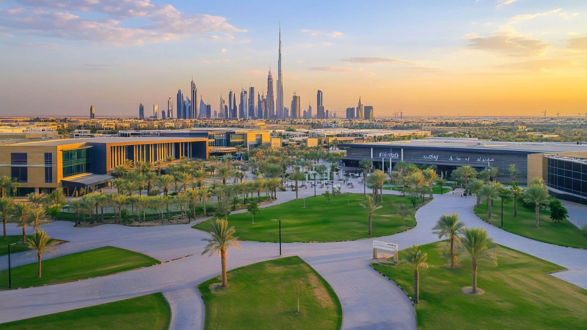 Modern Dubai university campus with Burj Khalifa skyline at sunset