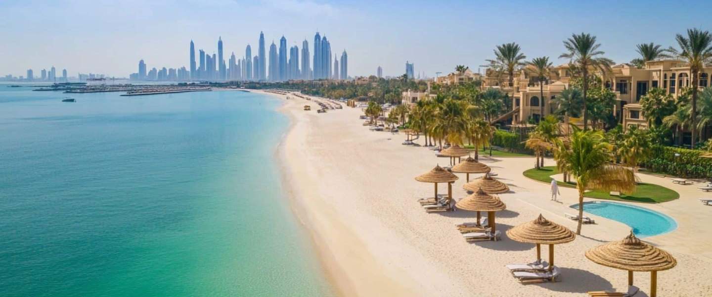 Top Best Dubai Beaches for the Wealthy Exclusive Dubai beach with luxury villas, shaded loungers, palm trees, and crystal-clear water overlooking the city skyline