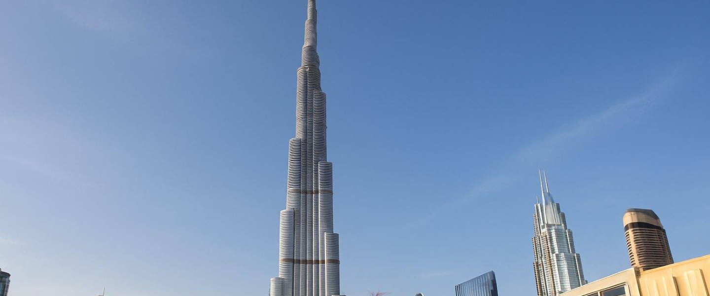 Top Landmark Buildings in Dubai You Need to Know Burj Khalifa in Dubai against clear blue sky surrounded by modern skyscrapers