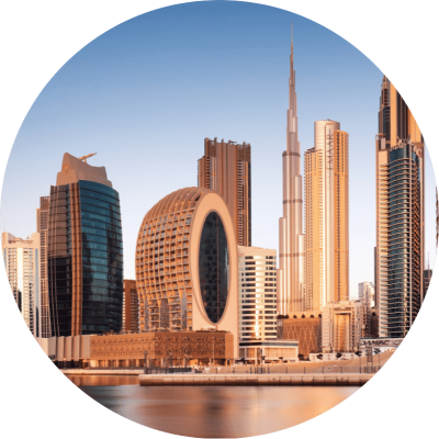 Circular image of Dubai's skyline featuring iconic skyscrapers against a clear blue sky