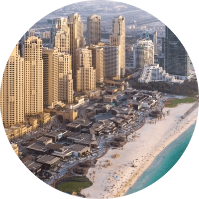 Circular view of Dubai showcasing a beach surrounded by modern buildings and the vibrant city skyline